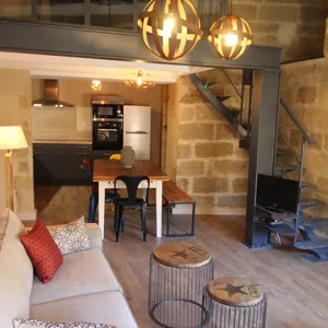 Vignette La pièce de vie et sa mezzanine avec verrière